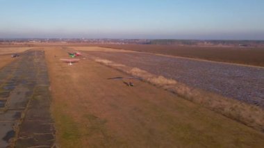 Hang glider trike take off from the airfield. Aerial footage