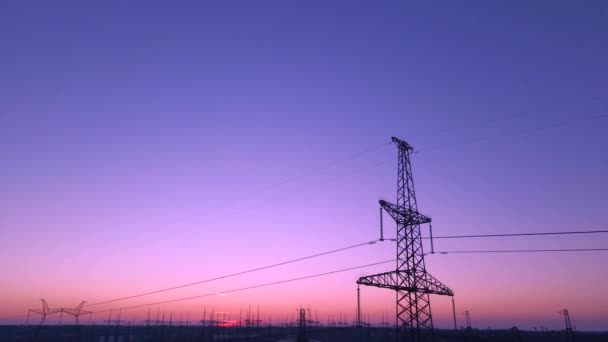 Growing Power Lines Towers Sunset Sky — стоковое видео