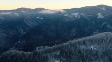 Cold morning in the winter mountains. Aerial footage