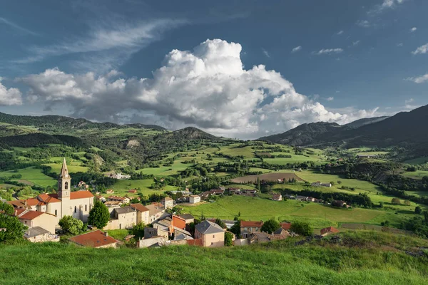 Scenic alpine town in the green mountain valley. Picturesque view in French Alps, Provence