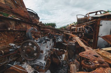 Cemetery of rusted and burned disposed cars after the war near Kyiv, Ukraine