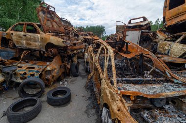 Car dump near Kyiv. Cemetary of burned cars after russian invasion
