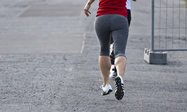 Jogger on asphalt — Stock Photo, Image