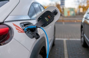 Electric car being charged at the charging station, Berlin, Germany
