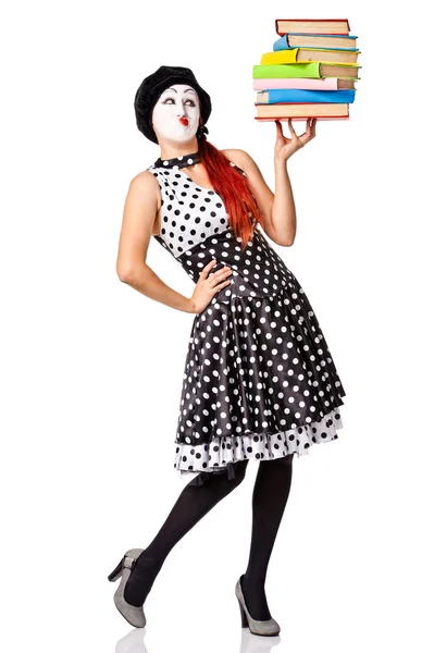 Beautiful mime in spotty dress holding stack color books — Zdjęcie stockowe