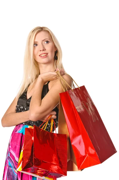 Retrato de una chica sosteniendo bolsos y sonriendo — Foto de Stock