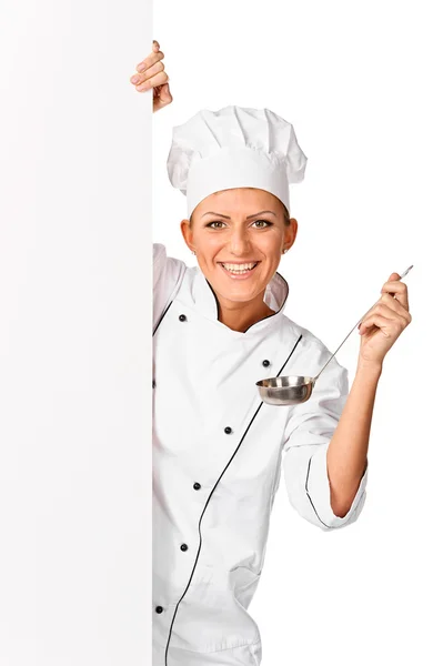 Cook, chef or baker with ladle peeking from blank white paper s — Stock Photo, Image