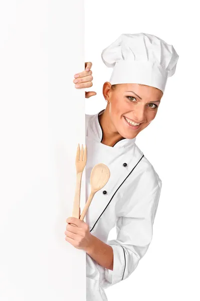 Mujer chef, panadero o cocinero sonriendo feliz sosteniendo en blanco pape blanco — Foto de Stock