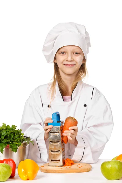 Щасливий маленький шеф-кухар з великою кількістю овочів — стокове фото