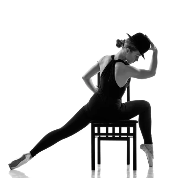 Pretty young ballerina sitting on the chair. — Stock Photo, Image