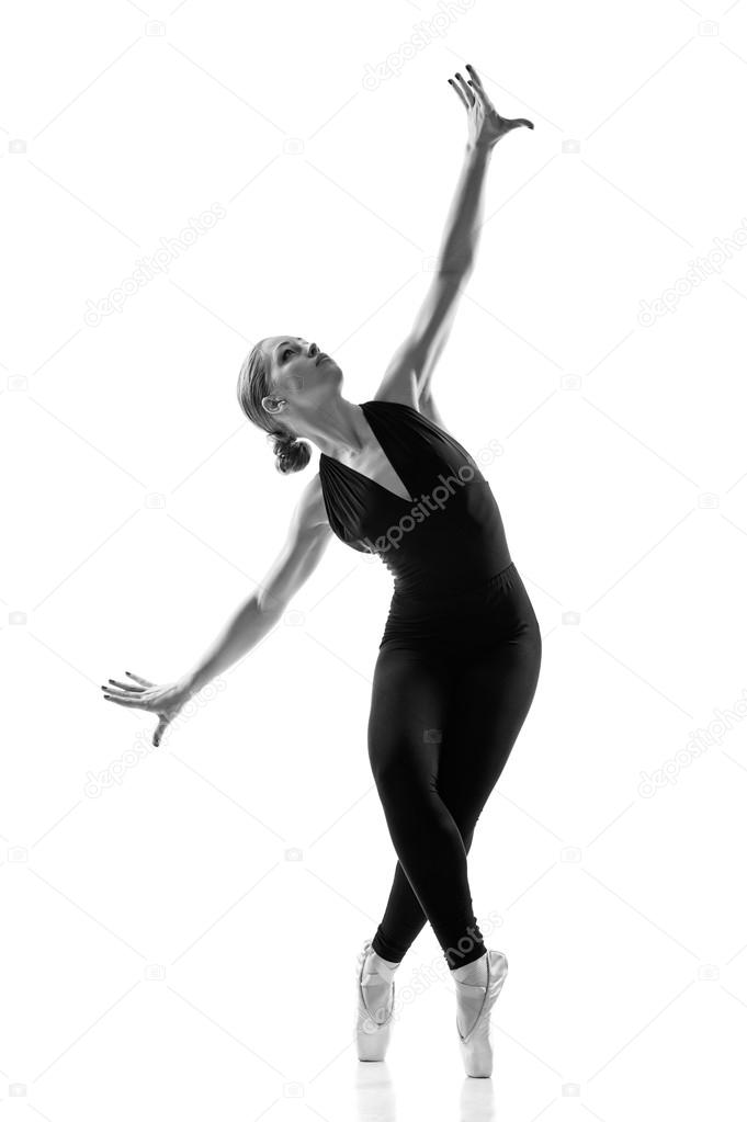 Young caucasian woman ballet dancer in silhouette