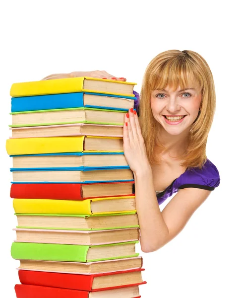Chica feliz con apilar libros de color. Aislado Fotos de stock libres de derechos