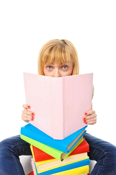 Sorprendida joven estudiante con libros, aislada Imagen de stock