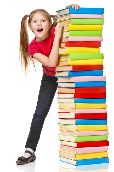 Colegiala sosteniendo un montón de libros. Aislado — Foto de Stock