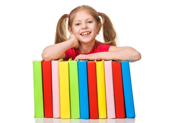 Happy Little girl holding pile of books. Isolated — Stock Photo, Image