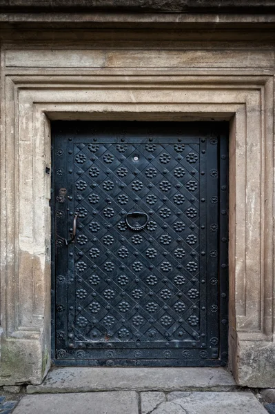 Closed metal door with decorative grille — Stock Photo, Image