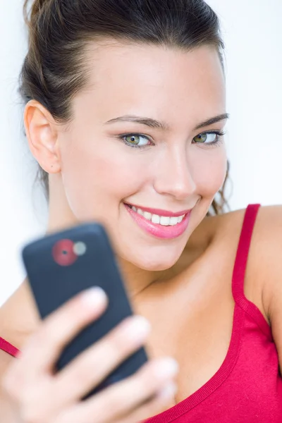Cute brunette woman taking photo of herself — Stock Photo, Image