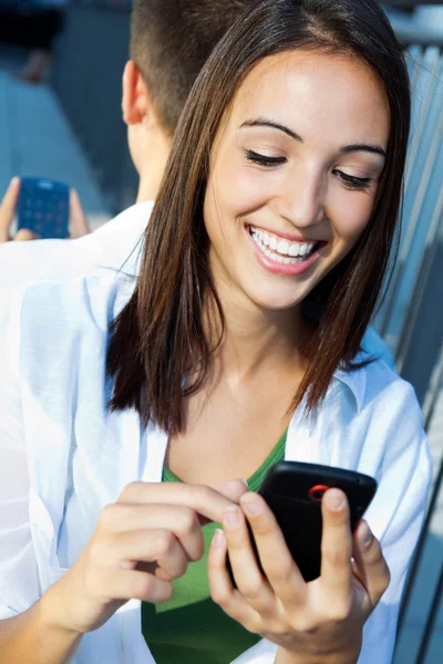 Young couple with smart phone — Stock Photo, Image