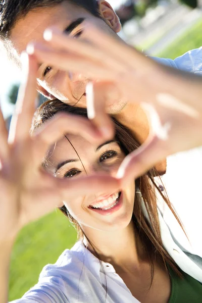 Young couple having fun in a park — Stock Photo, Image