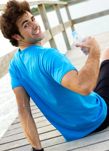 Man drinking water after sport activities — Stock Photo, Image