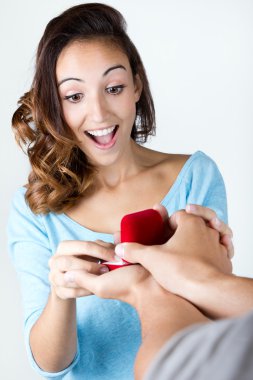 Young woman accepts an engagement ring clipart