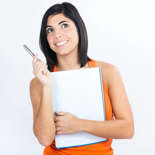 Junge Studentin mit Notizbuch und Stift plant ihren Tagesablauf — Stockfoto