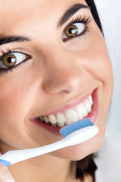 Beautiful young woman picking his teeth Stock Photo