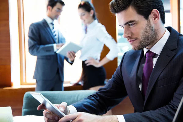 A business team of three in office and planning work — Stock Photo, Image