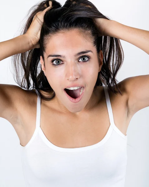 Jonge vrouw met haar gezicht verrast — Stockfoto