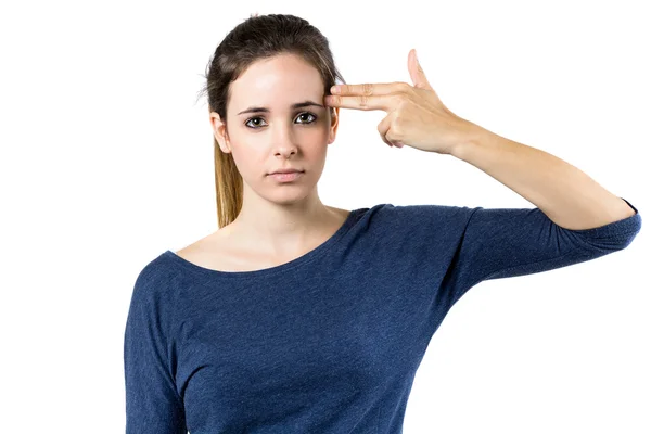 Young woman simulates to shoot himself in the head with one hand — Stock Photo, Image