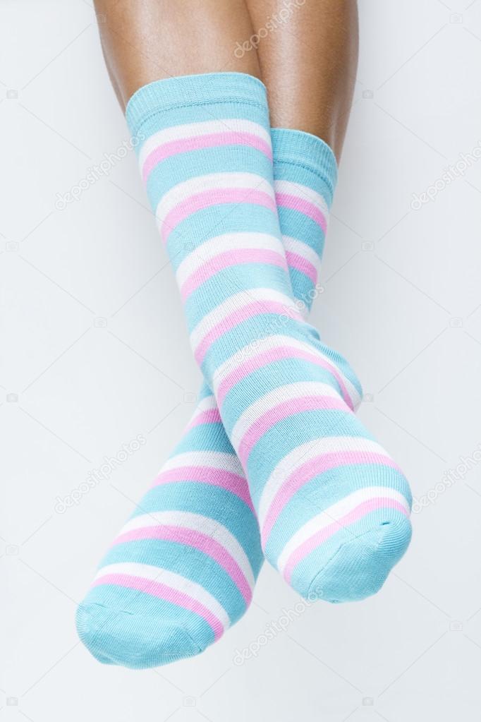 Woman legs in striped socks
