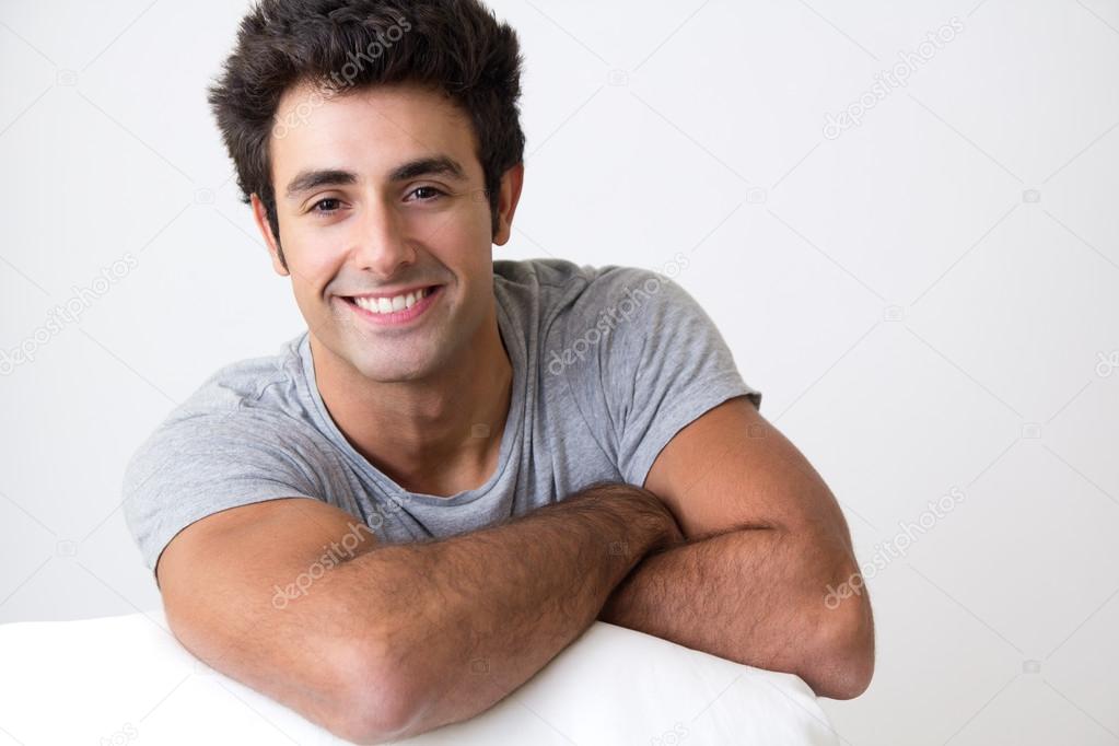 Happy young man relaxing at home