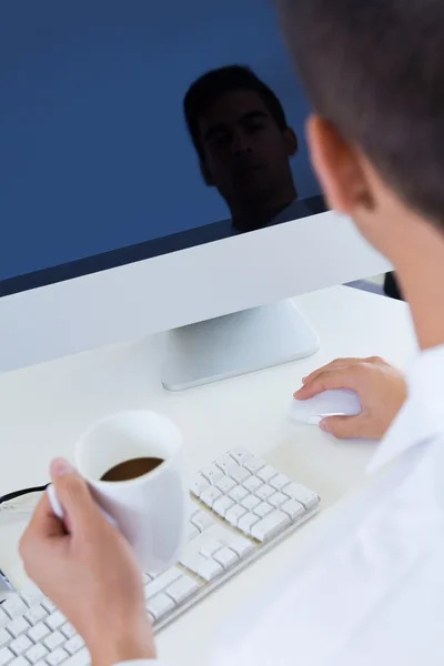 Happy young business man work in modern office on computer — Stock Photo, Image