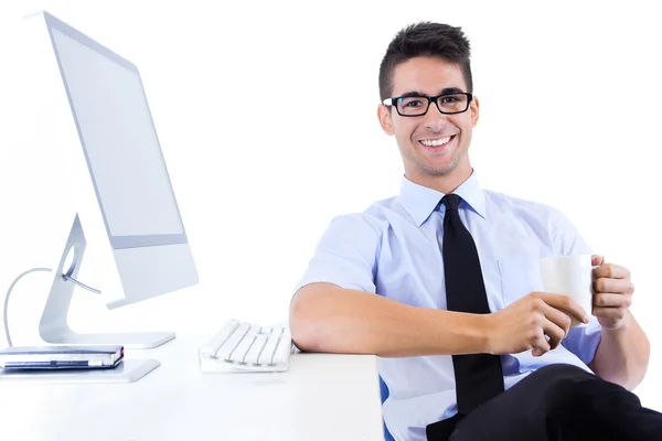 Happy young business man relaxing in modern office — Stock Photo, Image