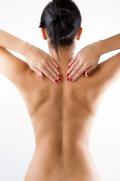Mujer joven con dolor en la espalda —  Fotos de Stock