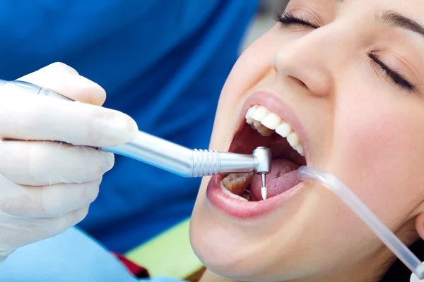 Cute young woman at the dentist. Mouth checkup — Stock Photo, Image