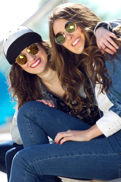 Young beautiful girls with denim suit in a urban background — Stock Photo, Image