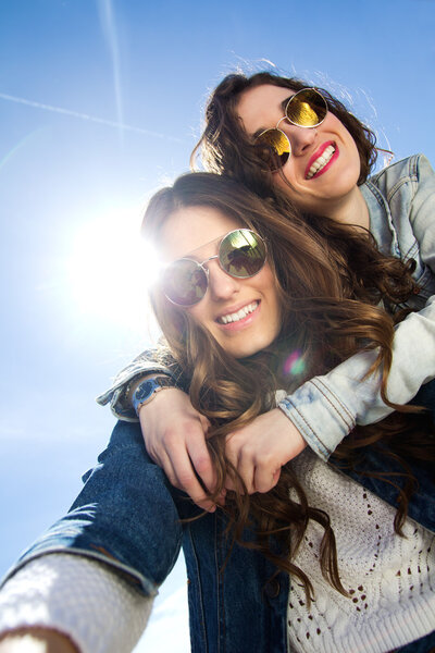 Selfie girls taking photos with a smartphone