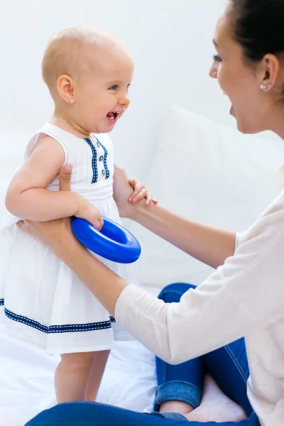 Baby girl and her mother playing at home — Stock Photo, Image