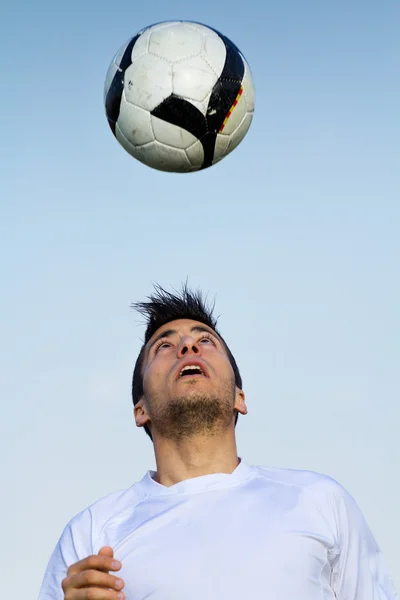 Football player striking the ball at the stadium — Stock Photo, Image