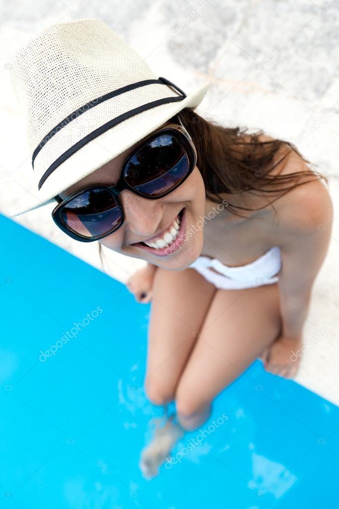 Beautiful, young, sexy girl enjoy in the summer near the pool. 