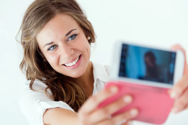 Beautiful blonde girl taking selfie. Isolated on white. — Stock Photo, Image