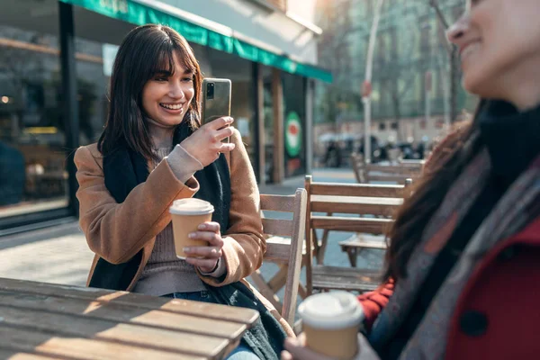 Shot Two Attractive Friends Enjoying Coffee Together While Taking Photo — Foto Stock