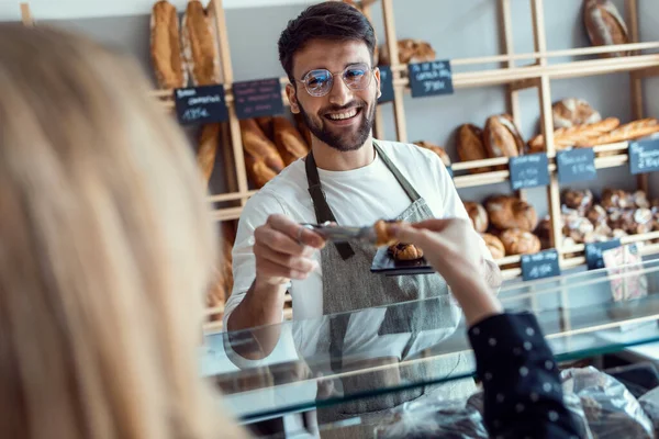 Shot Smiling Man Seller Giving Fresh Chocolate Croissants Cheerful Woman — 스톡 사진