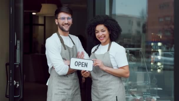 Video Two Owners Friends Holding Open Sign Together While Smiling — Vídeo de Stock