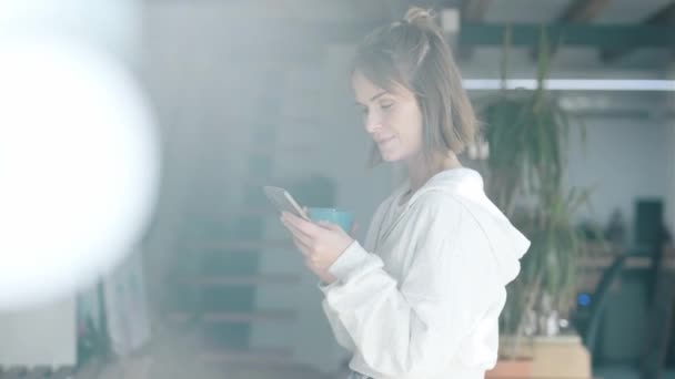 Video Cheerful Woman Drinking Cup Coffee While Using Mobile Phone — Stock video