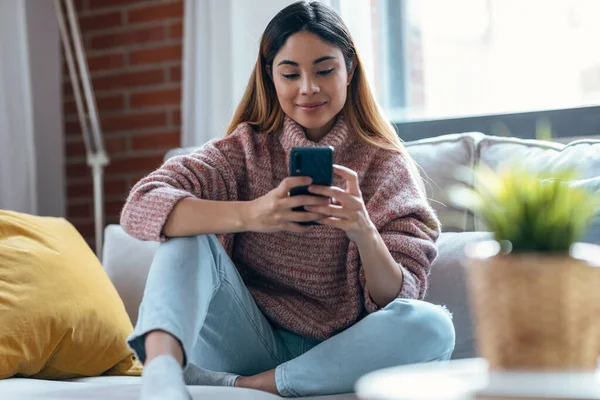 Shot Confident Young Woman Using Her Mobile Phone While Sitting — 图库照片