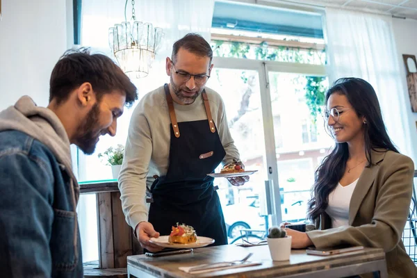 Shot Handsome Waitress Man Serving Healthy Delicious Toasts Smiling Couple —  Fotos de Stock