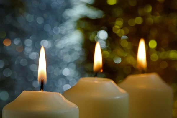 Candles with a Sparkling Tinsel Background — Stock Photo, Image