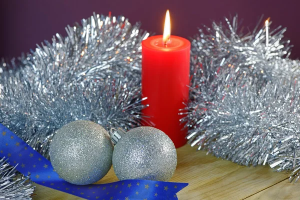 Christmas Baubles and Candle with Tinsel — Stock Photo, Image